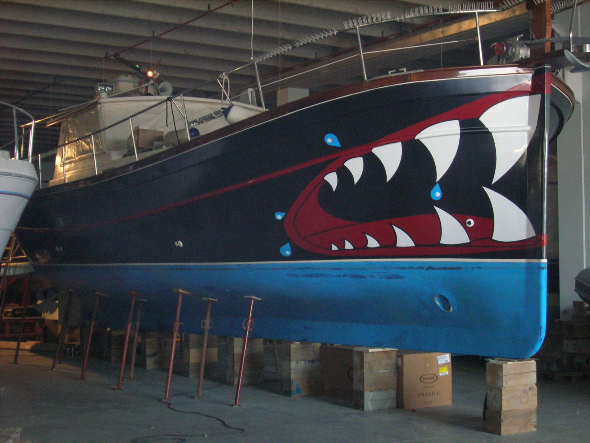 Mimetika technicians applying a wrap film to a yacht hull